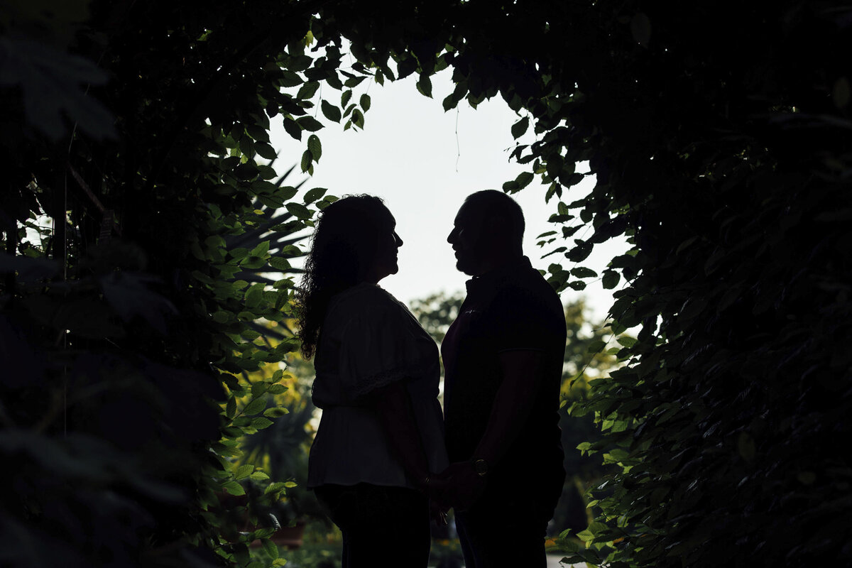 Couple in silhouette during spring engagement shoot at Longwood Gardens in Kennett Square Pennsylvania