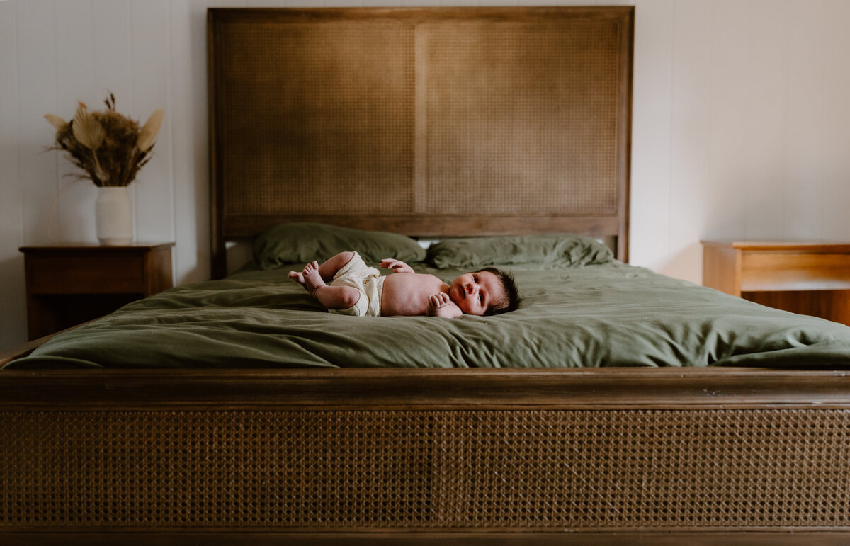 Newborn on bed