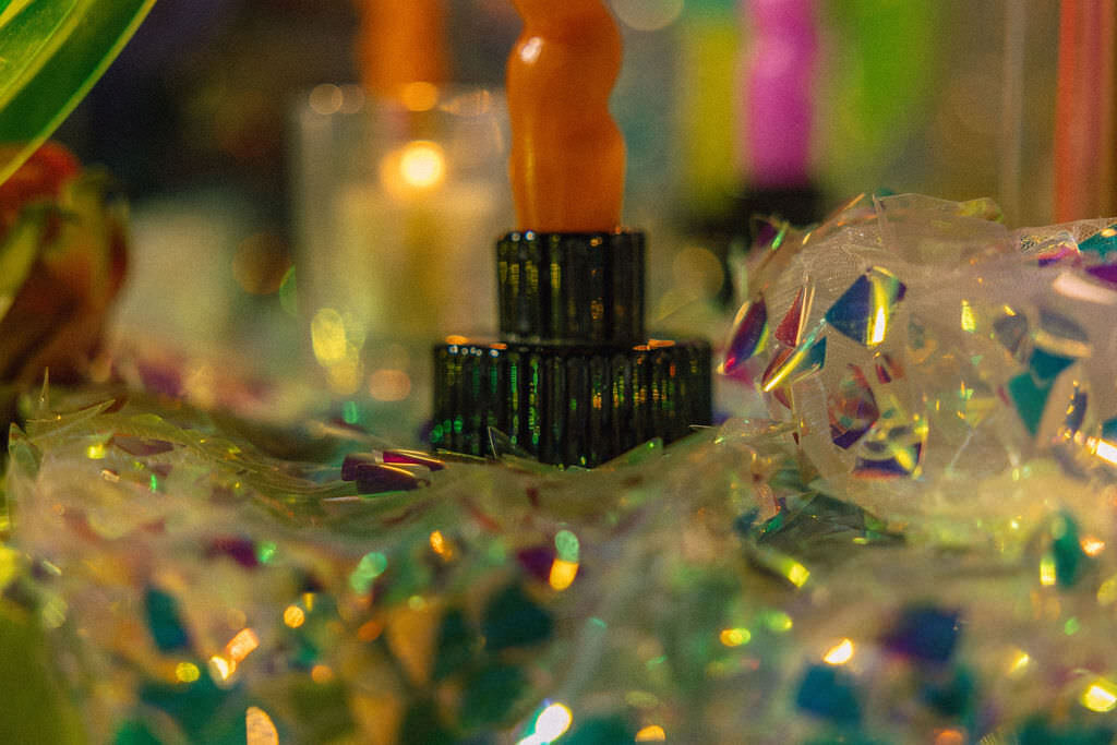 Candles and decorations on a wedding reception table.