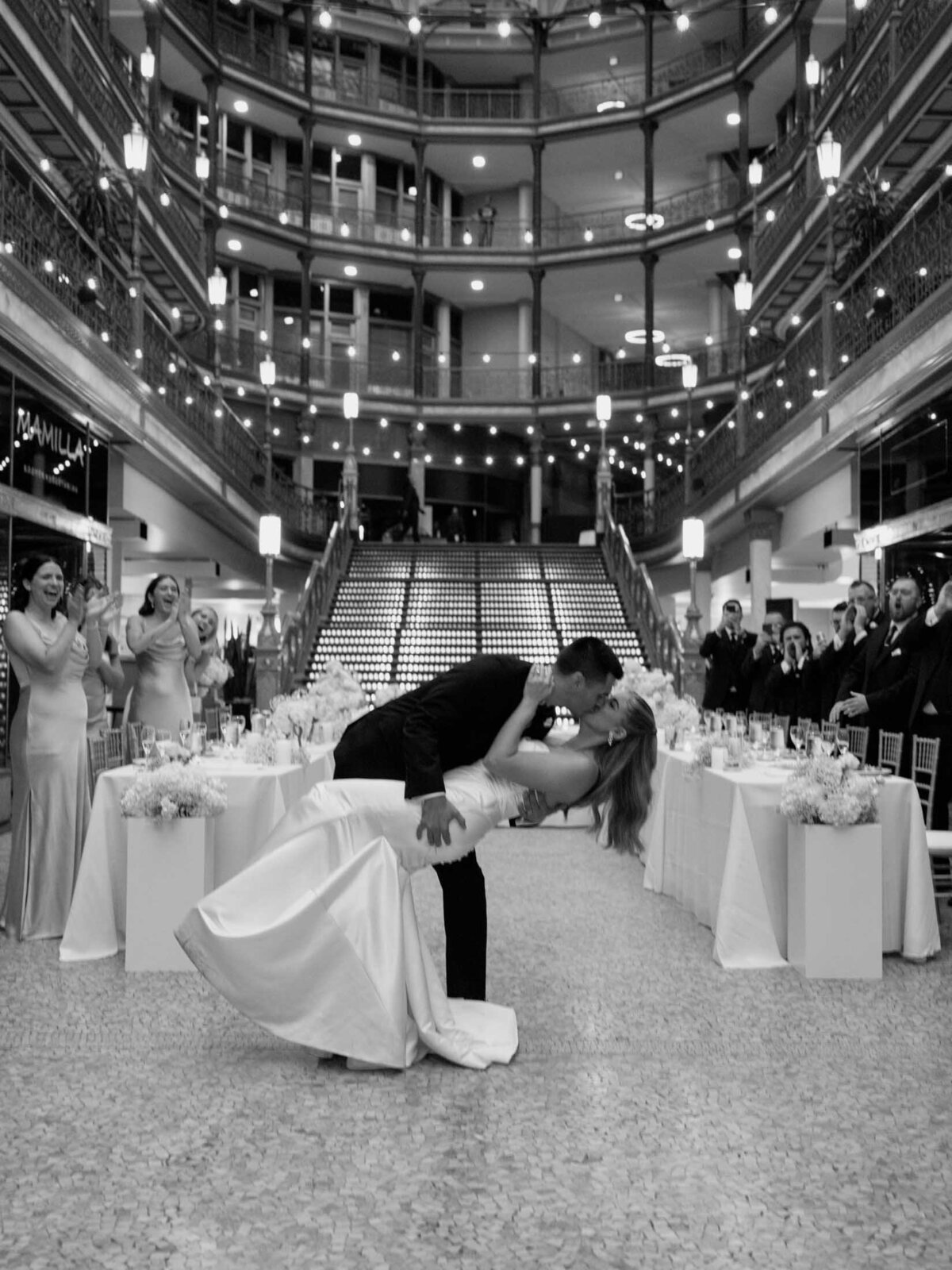 Newlyweds dancing beneath the skylight at The Arcade