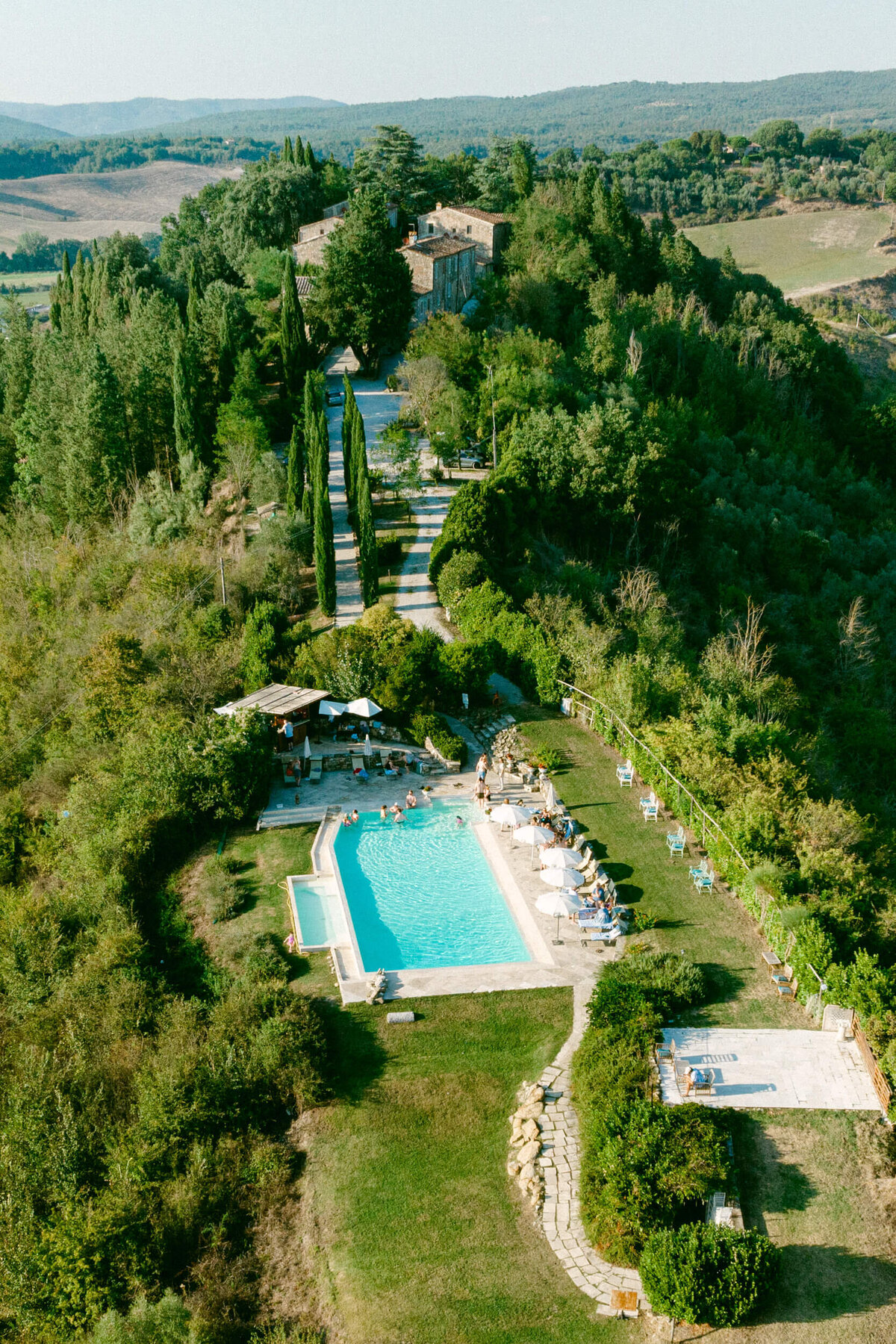 An aerial wedding drone photo of a welcome dinner at Laticastelli in Tuscany Italy.