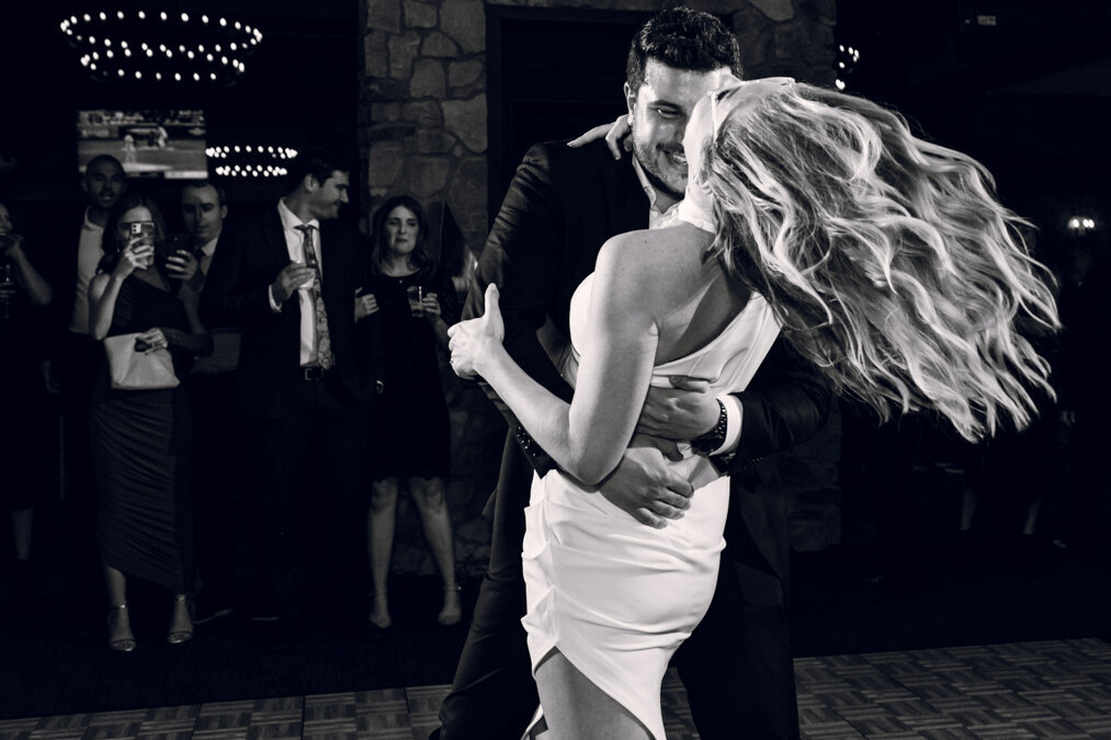 A bride and groom dancing at their wedding reception.