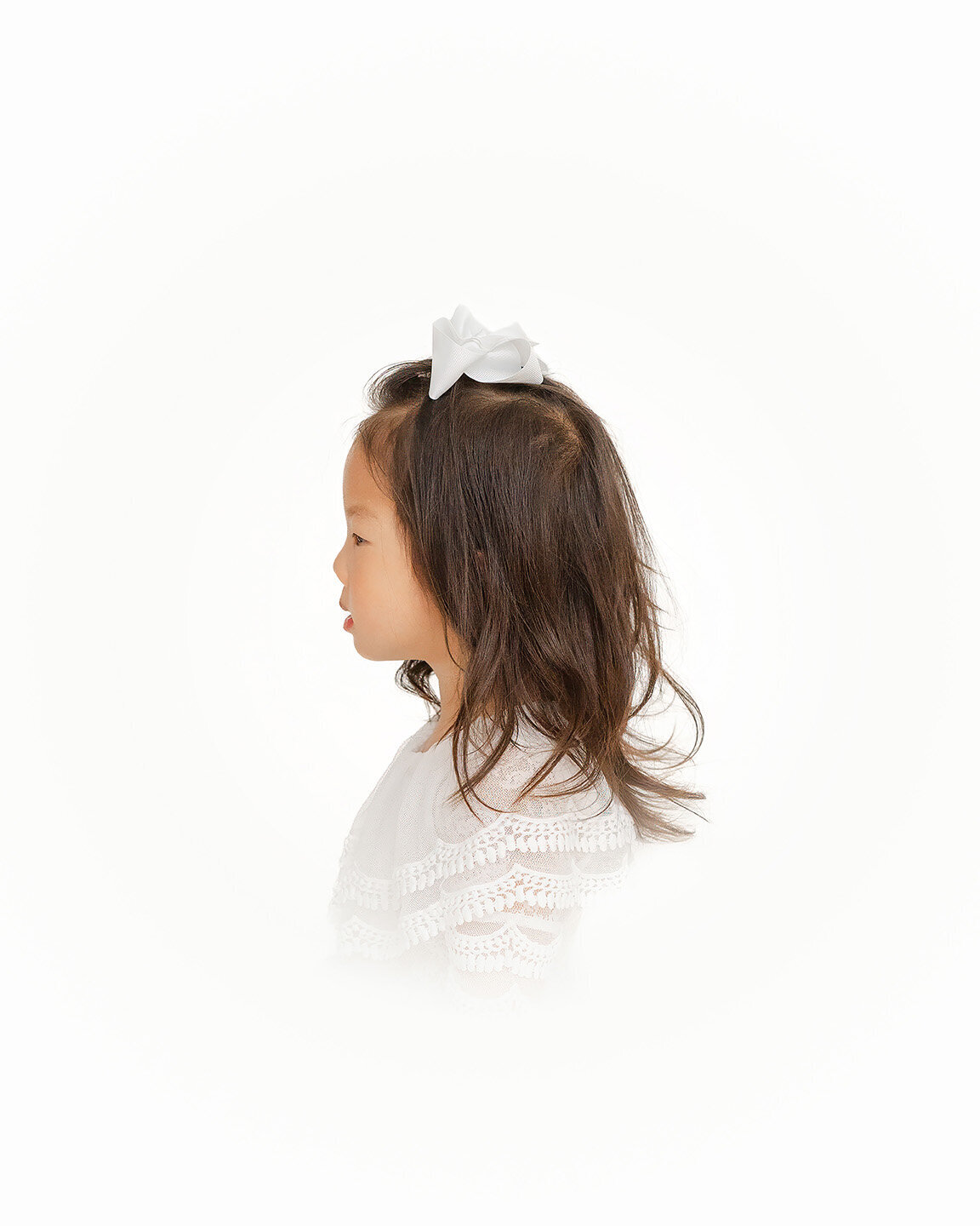 left side profile of toddler girl during heirloom portraits in Gainesville, Virginia