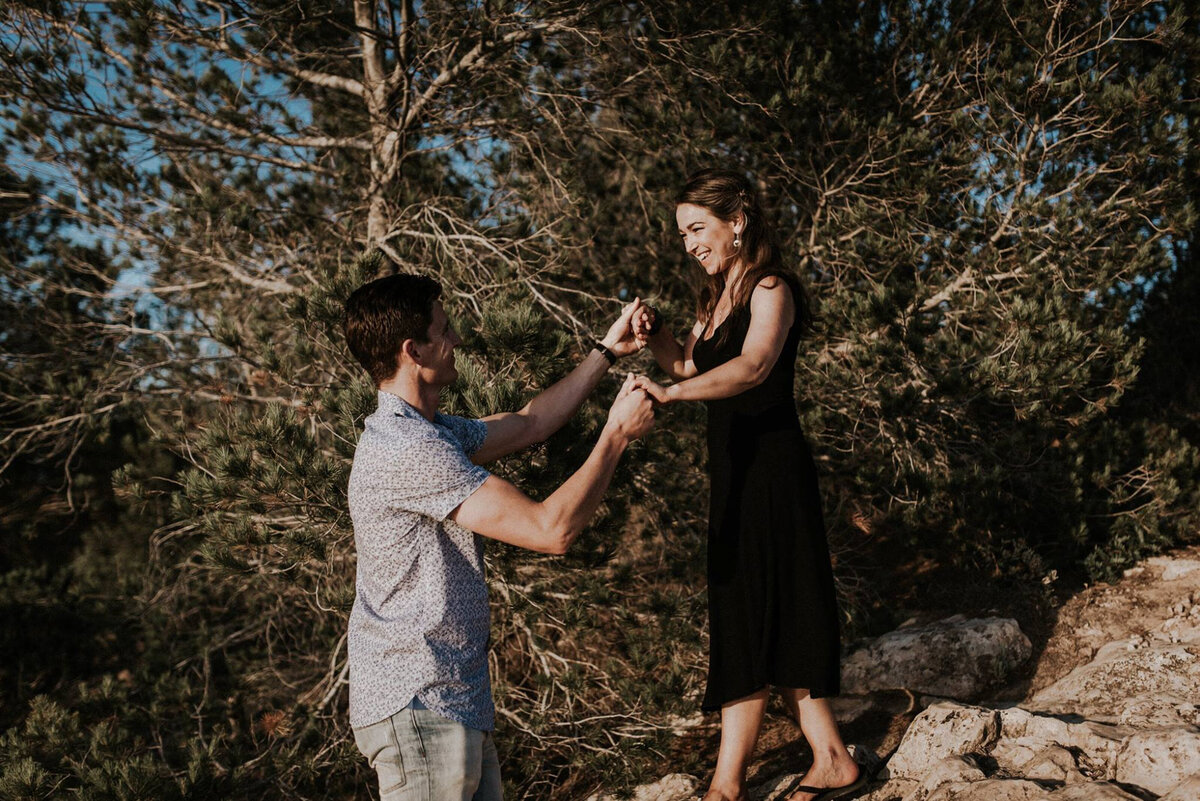 Devon Wedding Photographer Liberty Pearl Photography and her husband walking down a rocky hill