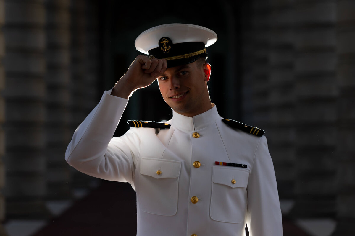 Dramatic backlit senior portrait at Naval Academy by Kelly Eskelsen, Annapolis Photographer.