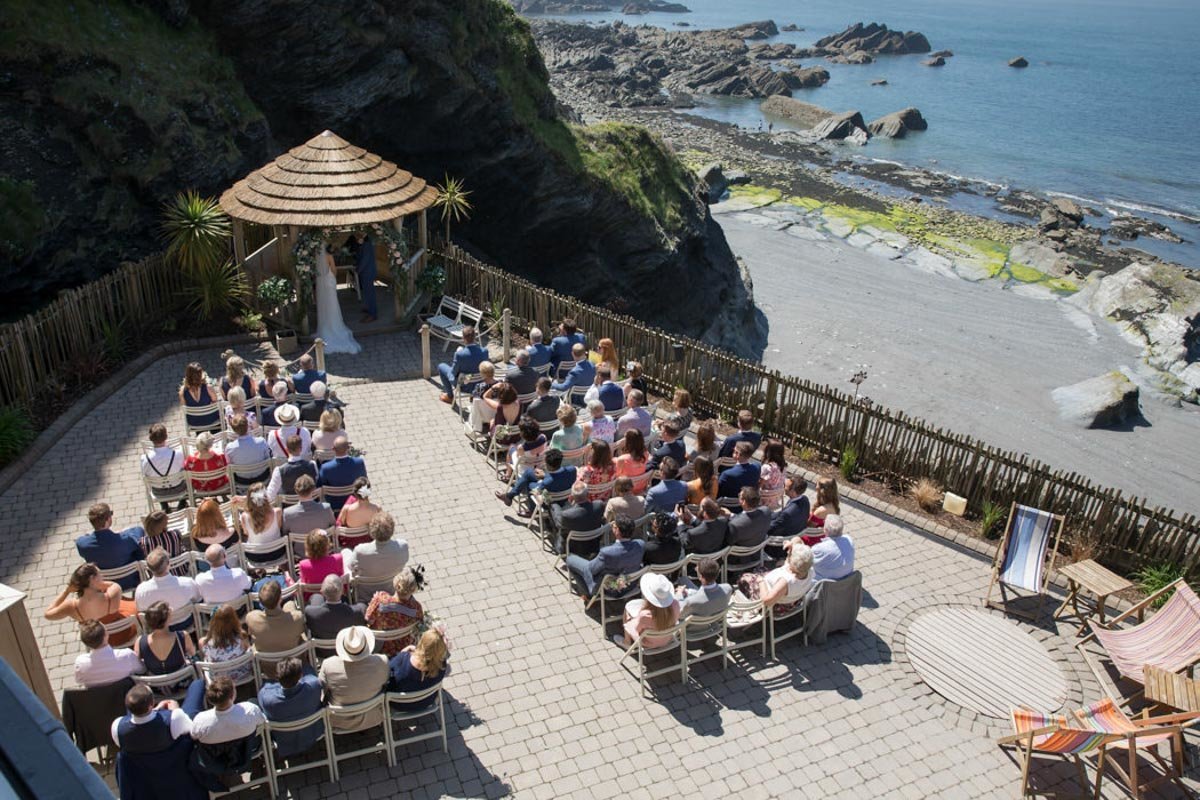 Outdoor wedding ceremony at Tunnels Beaches Devon