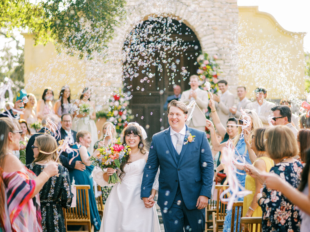 Garden party wedding ceremony at Camp Lucy in Dripping Springs