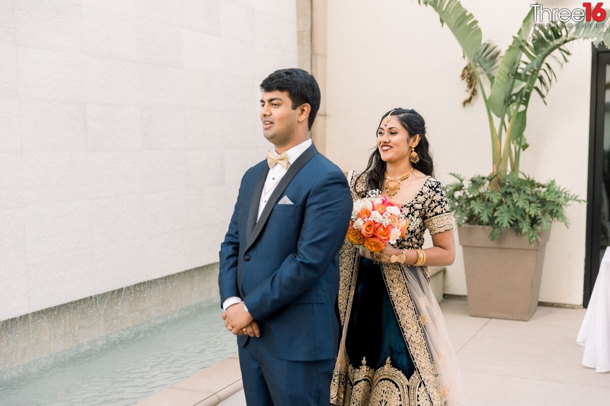 Indian Bride sneaks up from behind on her Groom for their first look