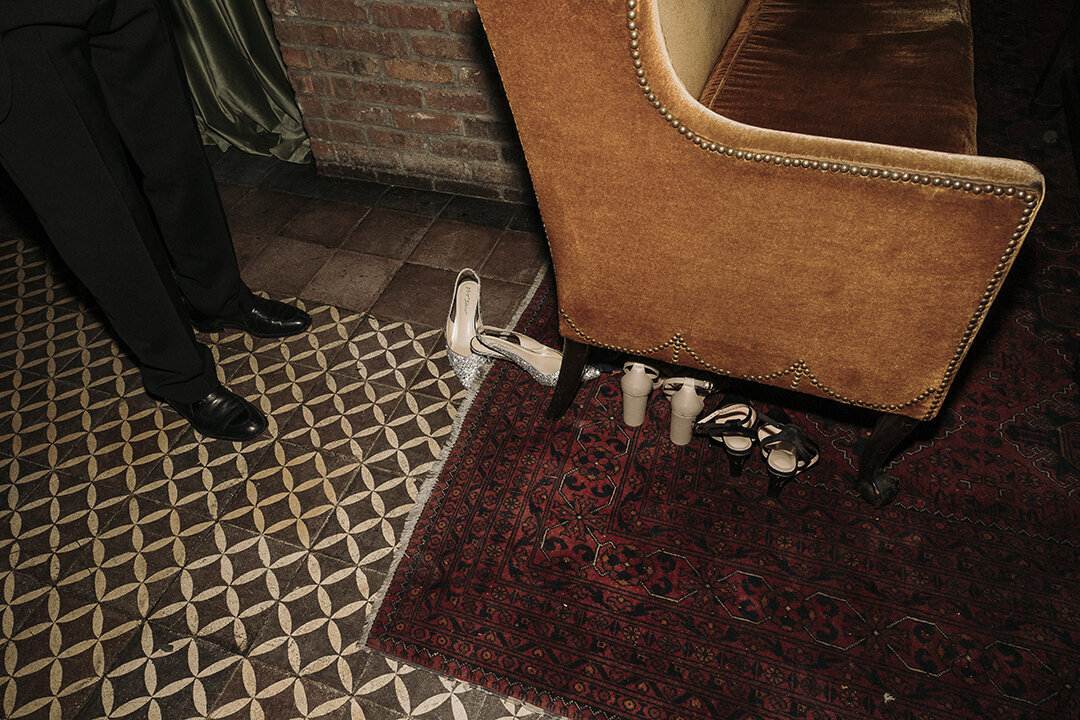 Women's shoes on floor at The Bowery Hotel in NYC. Captured by Mira Park Photography.