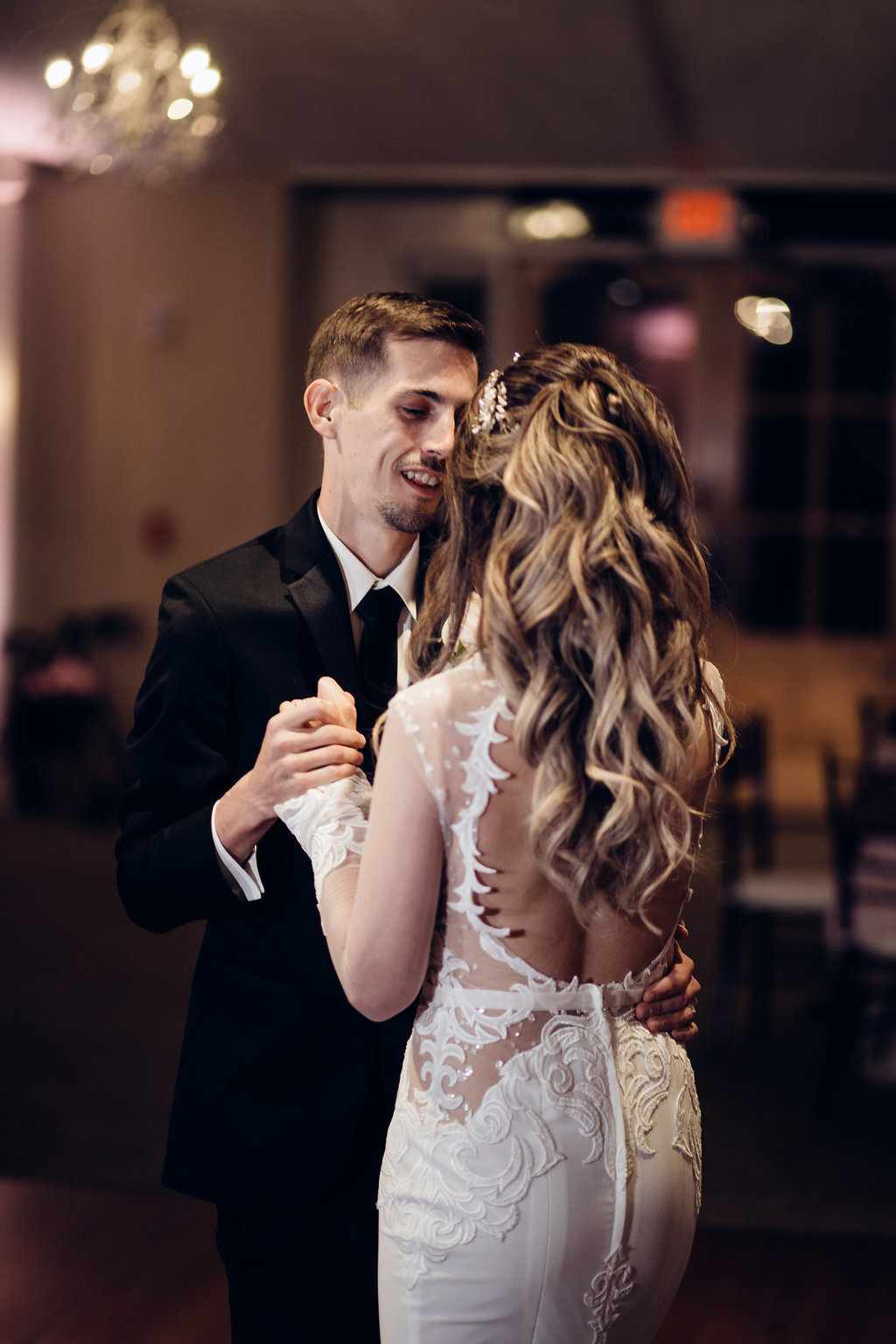 Wedding Photograph Of Groom Smiling While Dancing With His Bride Los Angeles