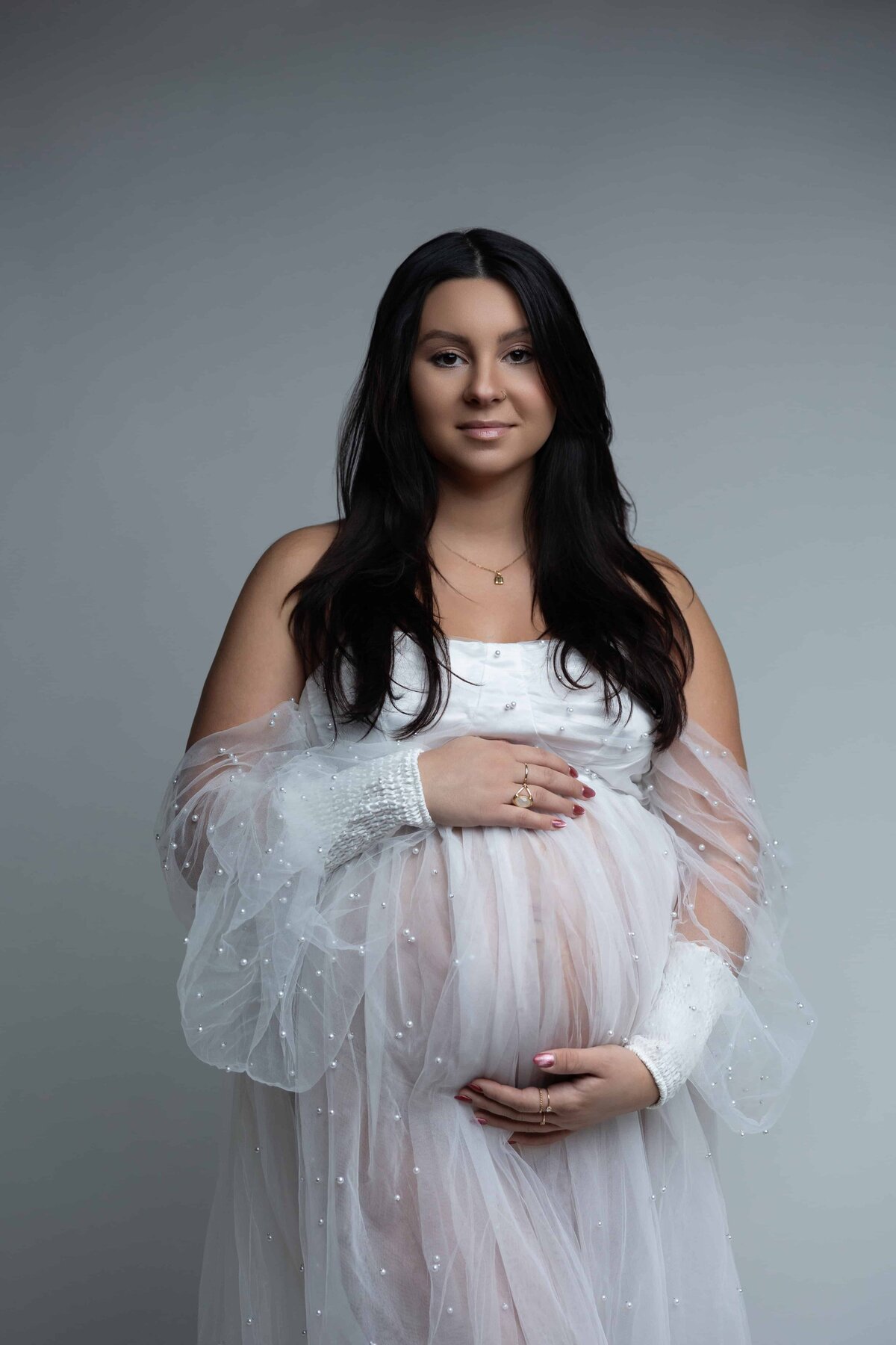 pregnant mom posing in studio