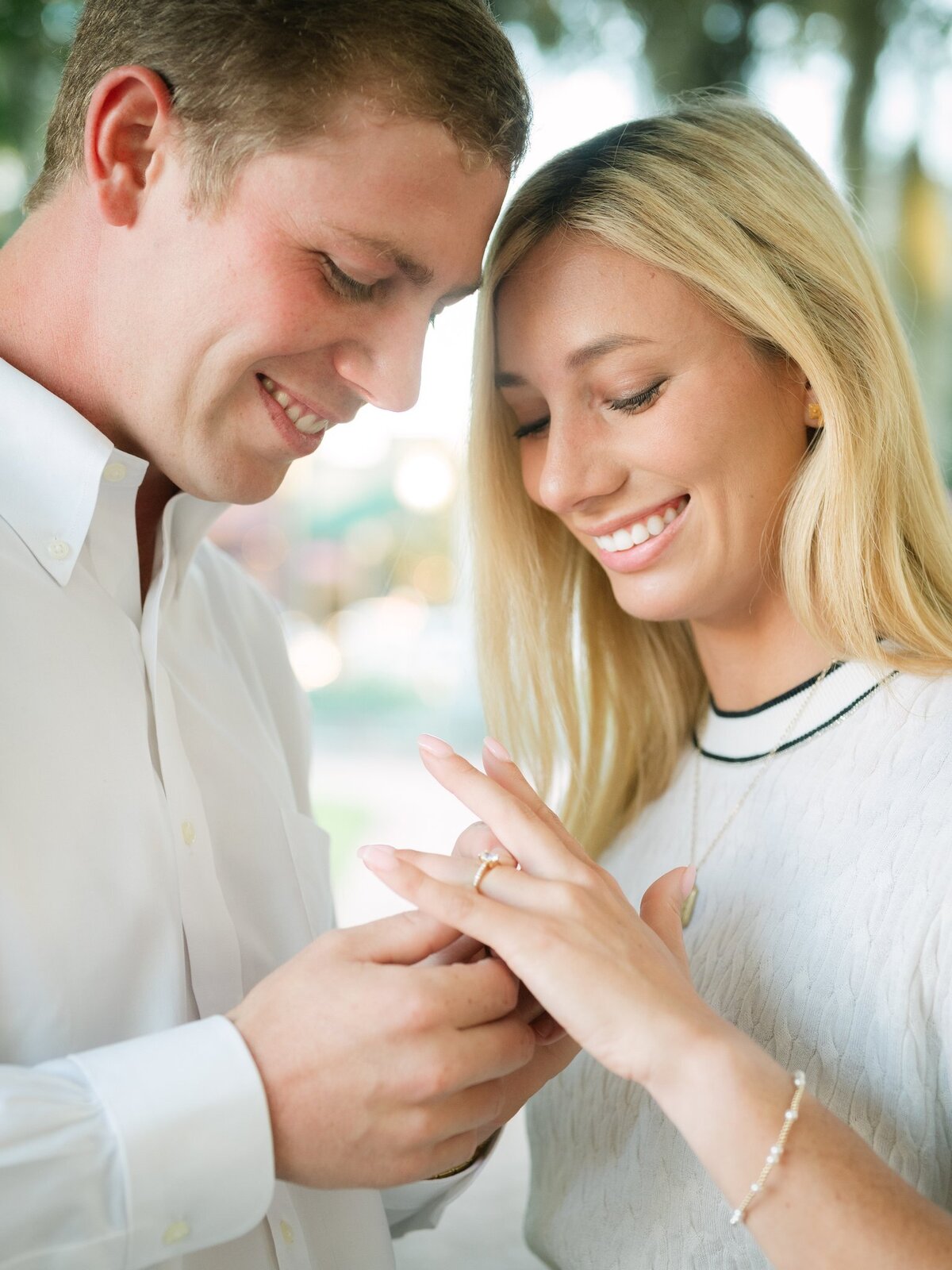 So happy! Newly engaged, and placing her ring on her finger. Serving couples in Bainbridge, GA & Tallahassee, FL. 