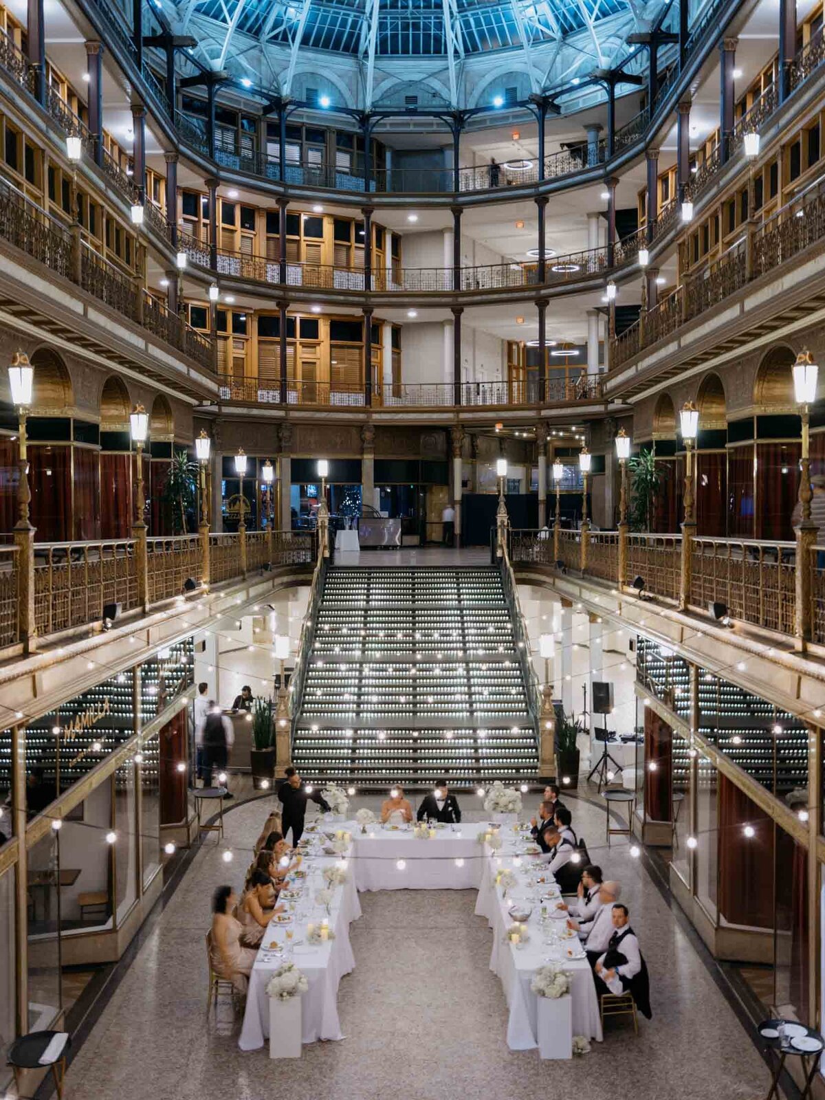 Overhead view of reception at The Arcade with string lights and modern decor