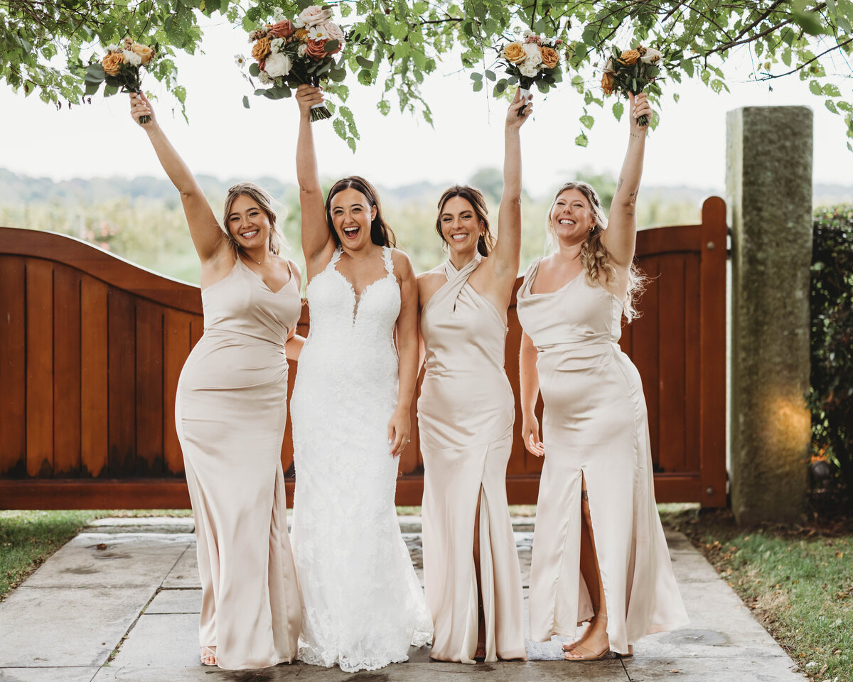 bride-bridesmaids-celebrate-wedding-saltwater-ct