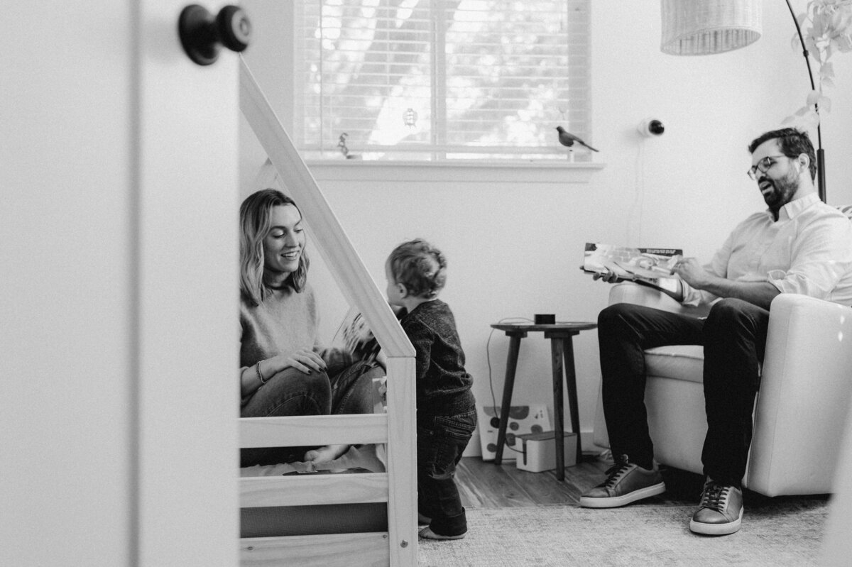 Mother and father in room of toddler at Austin family photo session