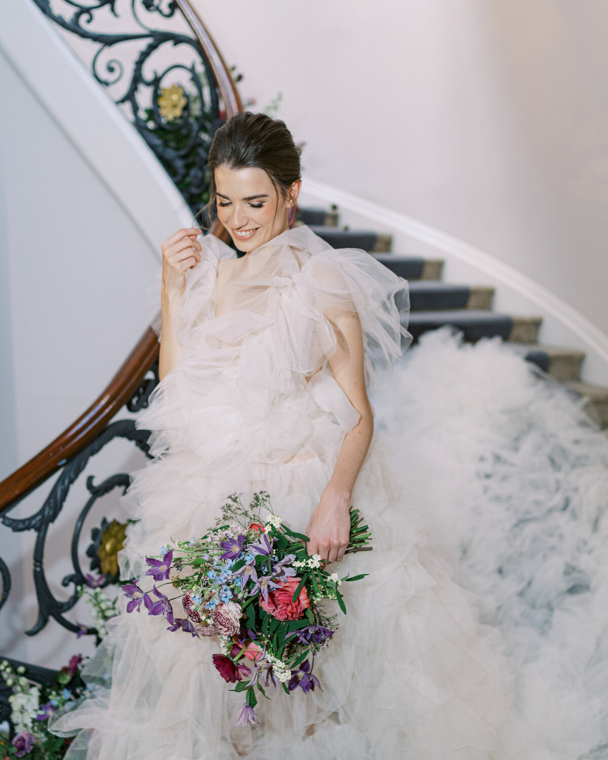 Bridal portrait in white tulle dress with colourful bouquet at London wedding