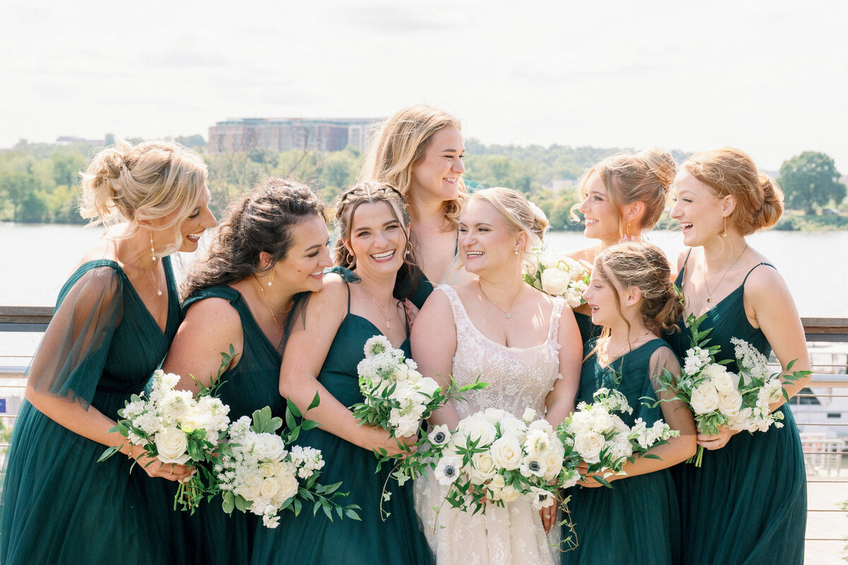White wedding party florals with greenery. Garden style floral design for waterfront wedding venues in Maryland.
