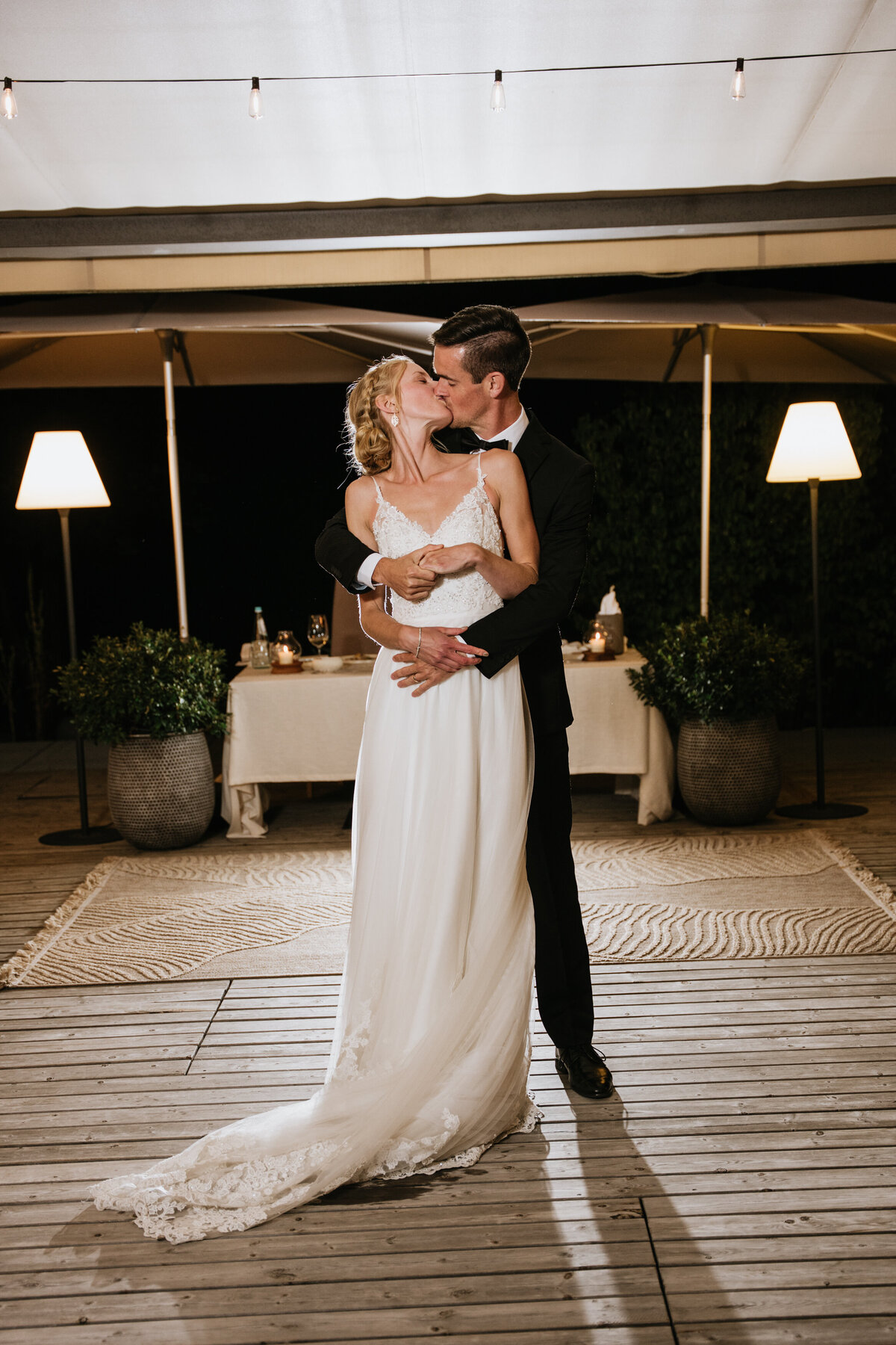 Bride and groom smiling during first dance
