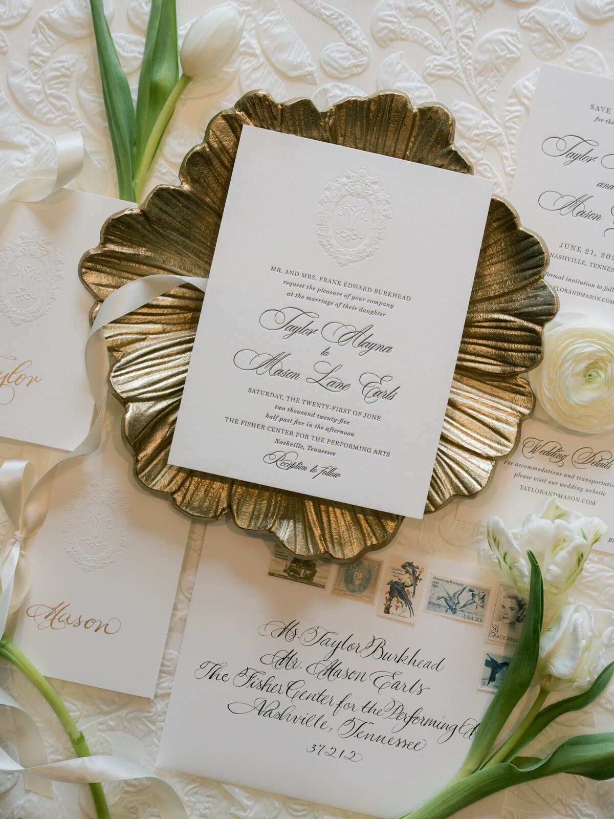 Black and white wedding invitation with custom crest featuring dog