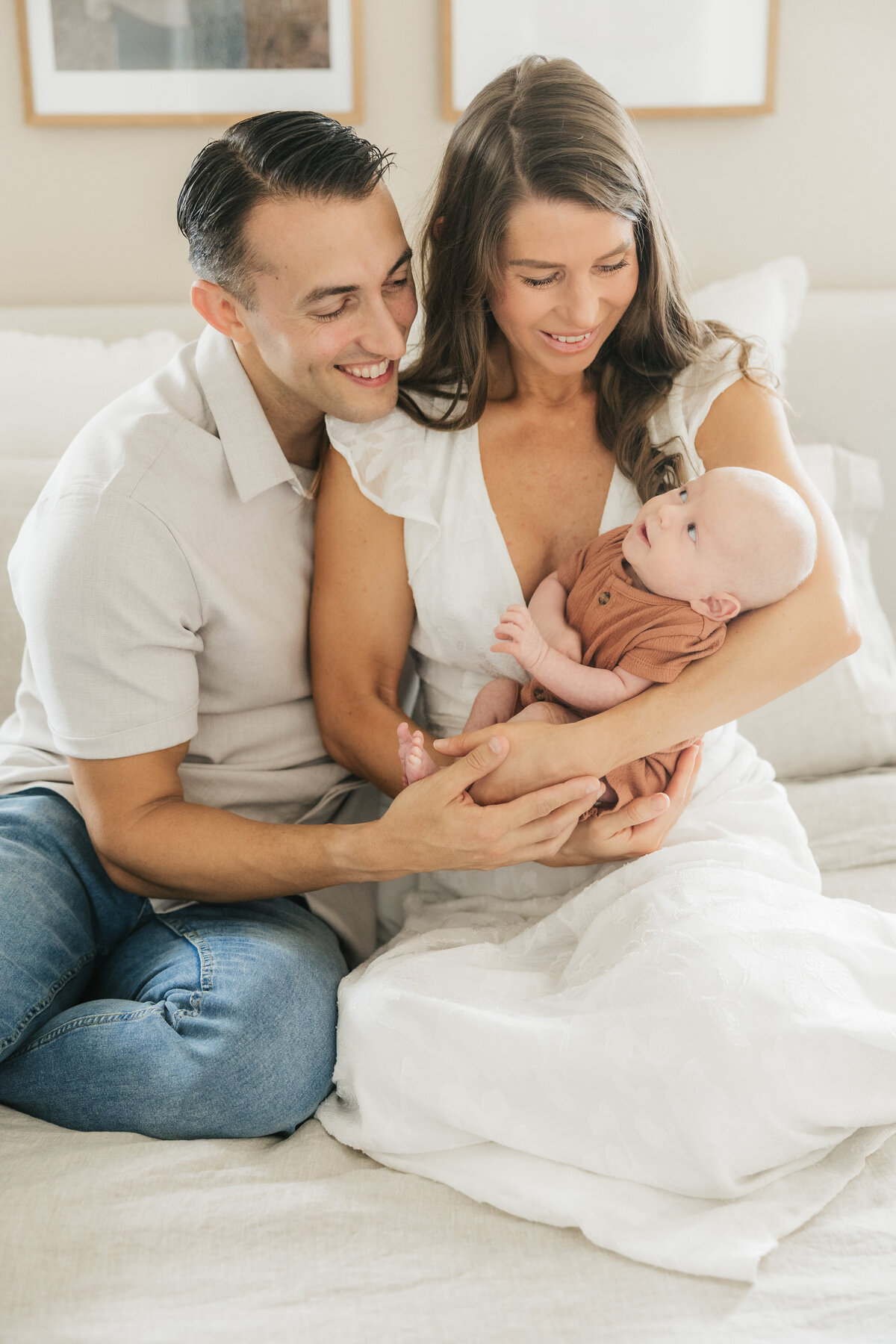 mom-and-dad-smile-at-newborn