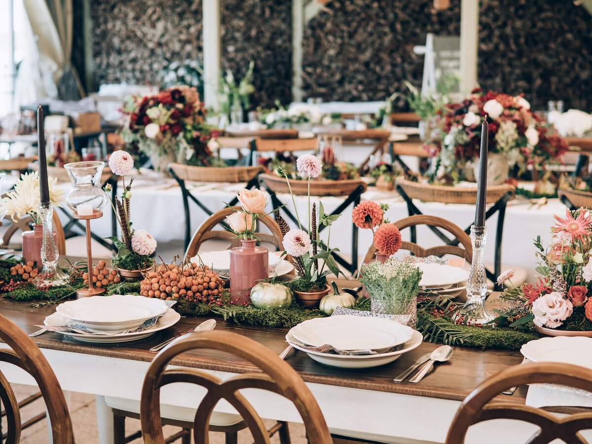 Wedding tablescape wood tables and chairs and elegant florals