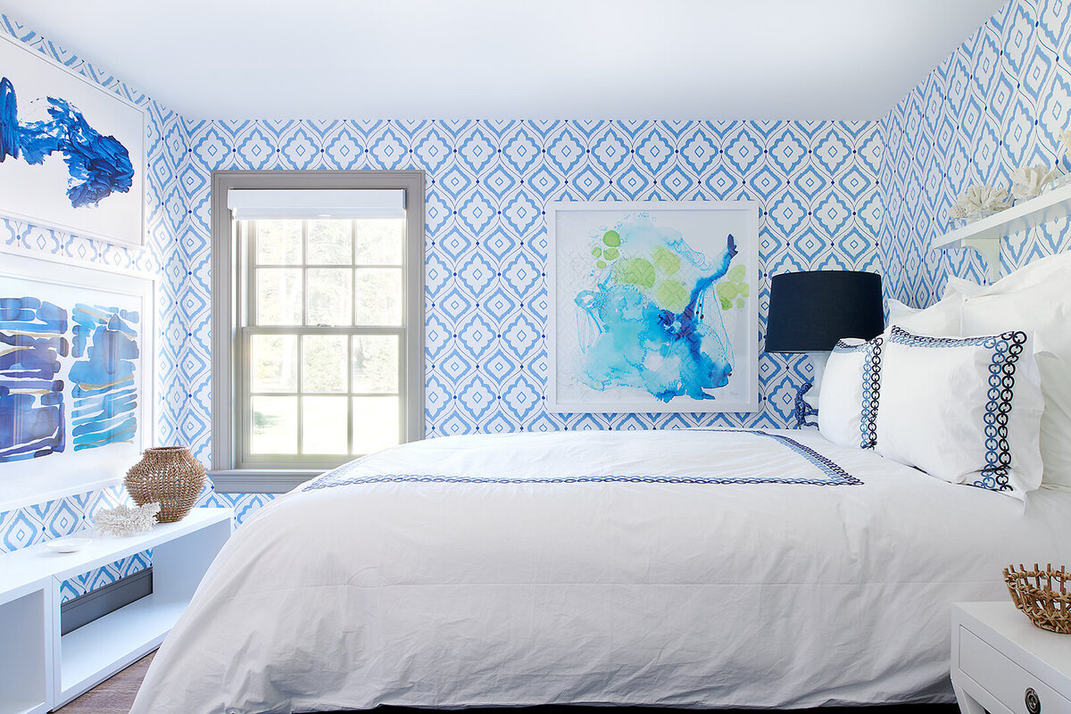 bedroom with blue patterned wallpaper