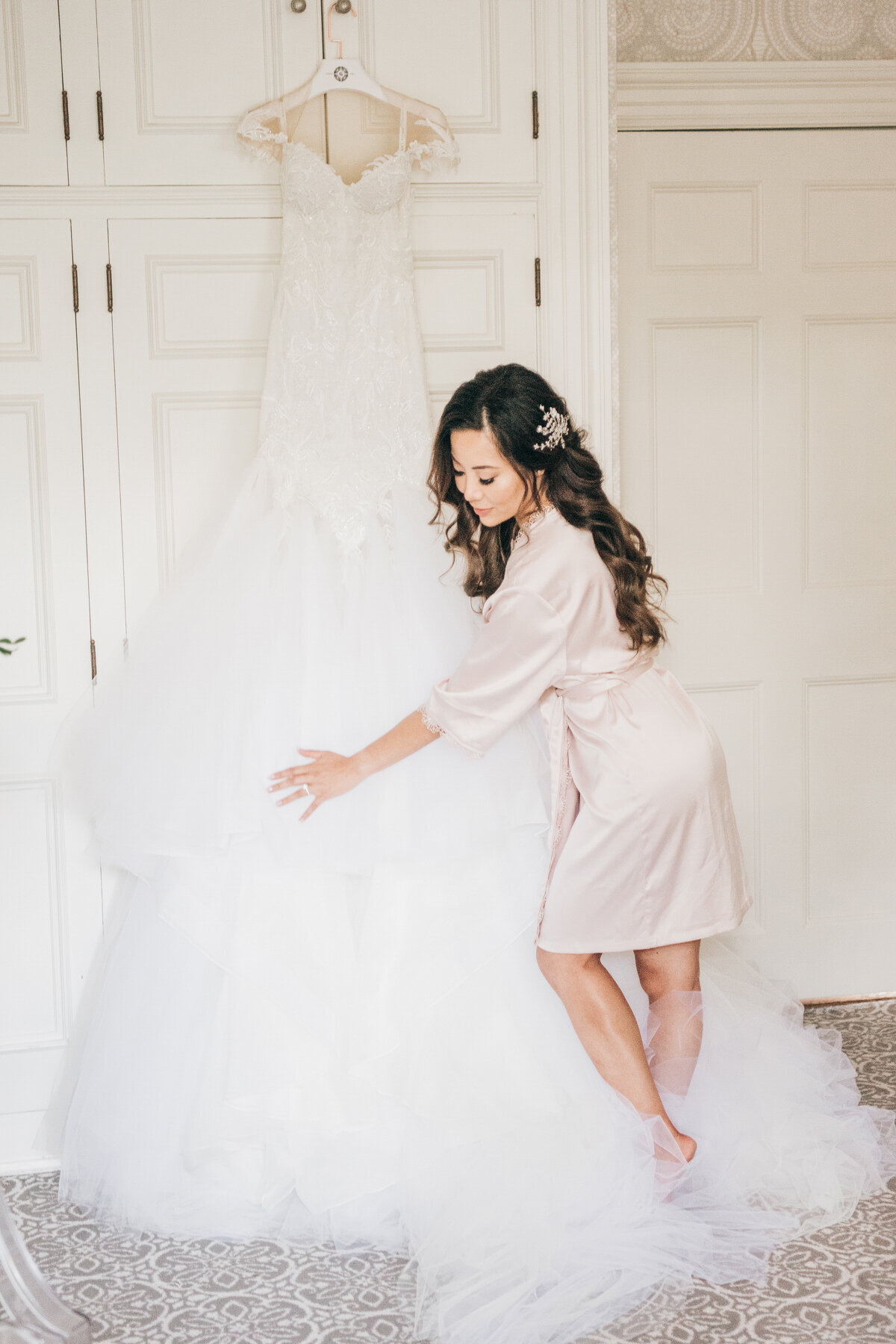 Bride getting ready with luxurious wedding dress