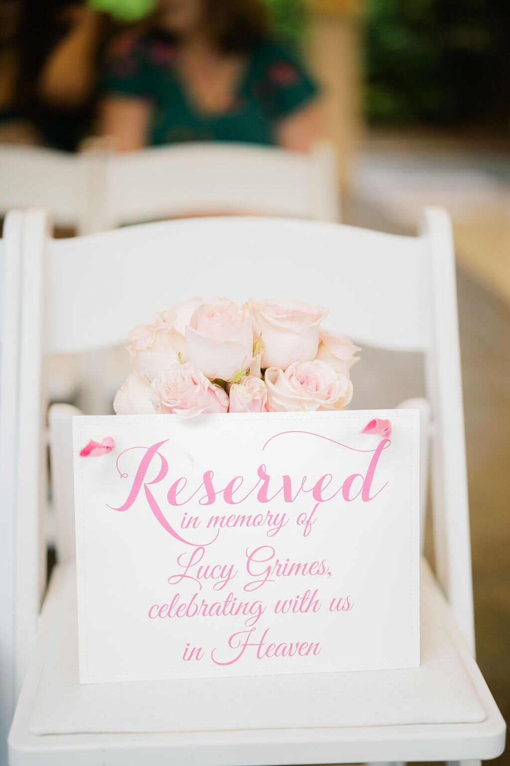 a chair with a reserved in memory of sign