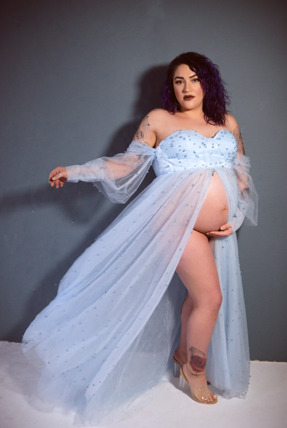 Dusty blue fly away dress  on a pregnant woman