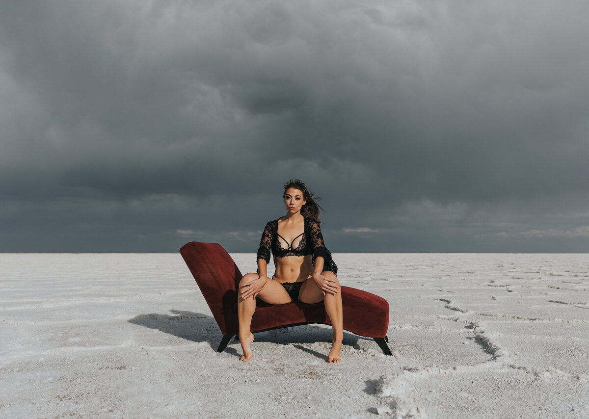 Storm rolling in behind woman during her boudoir shoot
