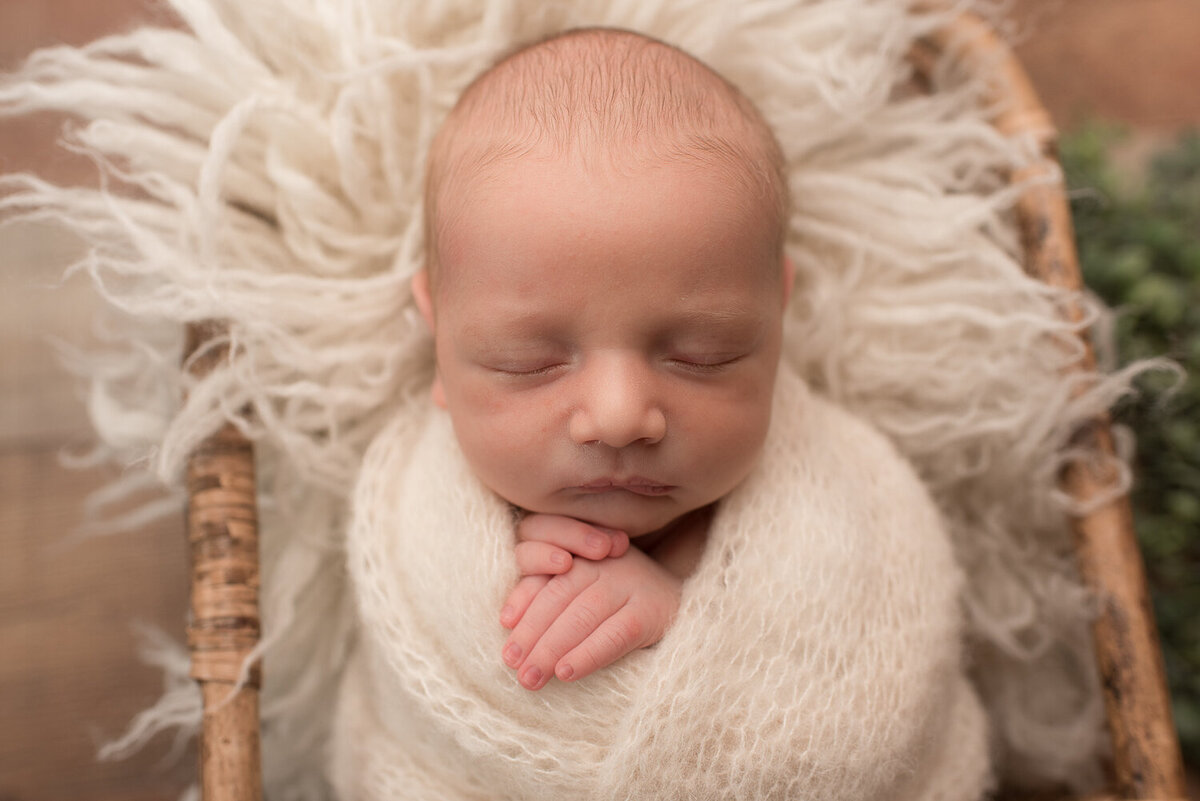 Close up of baby boy's face, swaddled in white wrap |Sharon Leger Photography | Canton, CT Newborn & Family Photographer