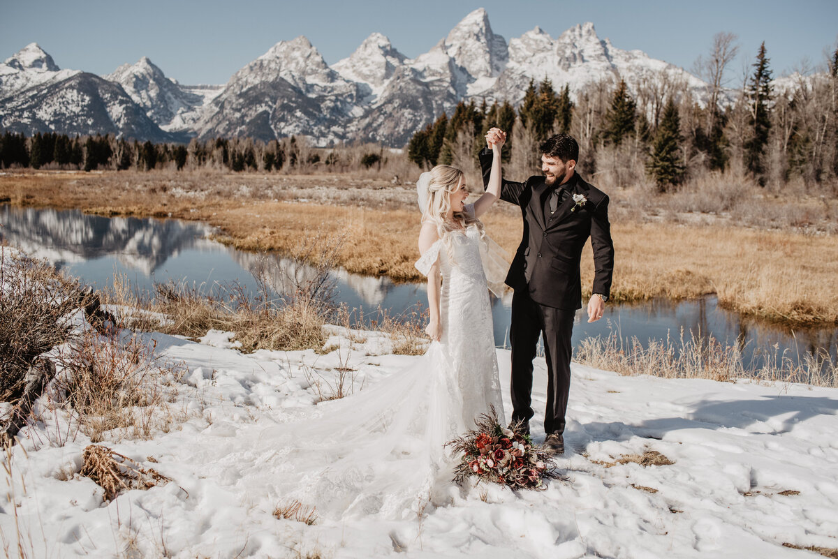 Jackson Hole Photographers capture couple raising hands to celebrate