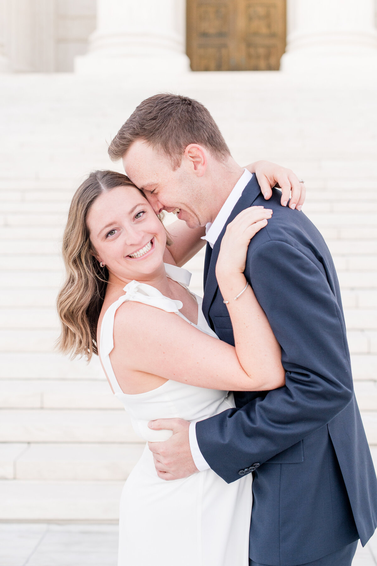 guy kissing th cheek of his fiancee