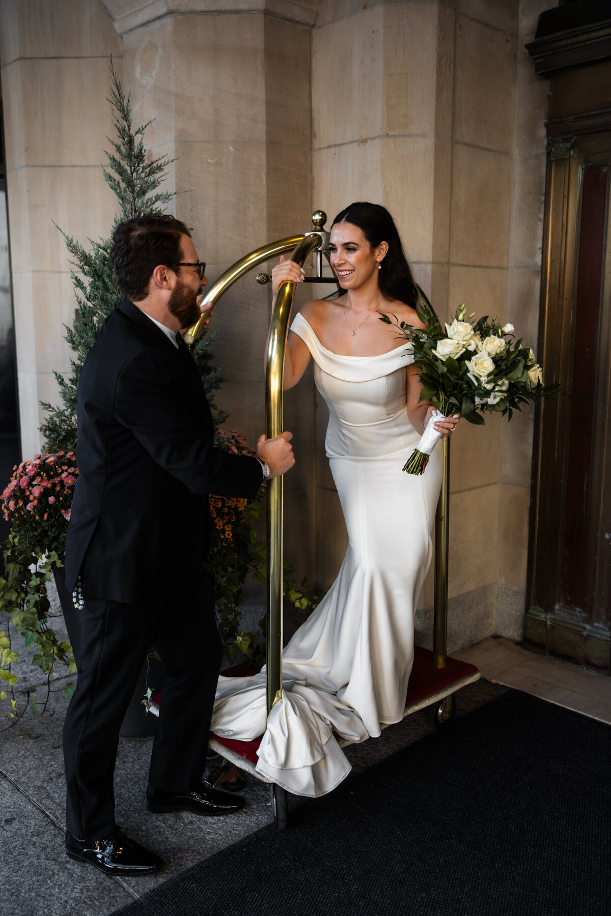 Newly wed couple outside of Chateau Laurier in Ottawa