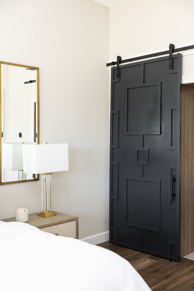 dewine design orlando interior designer windermere full home renovation black barn door and gold framed mirror