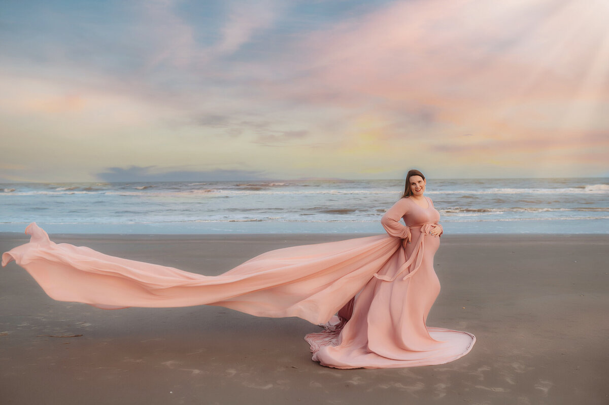 Pregnant woman poses for Beach Maternity Photos in Charleston.