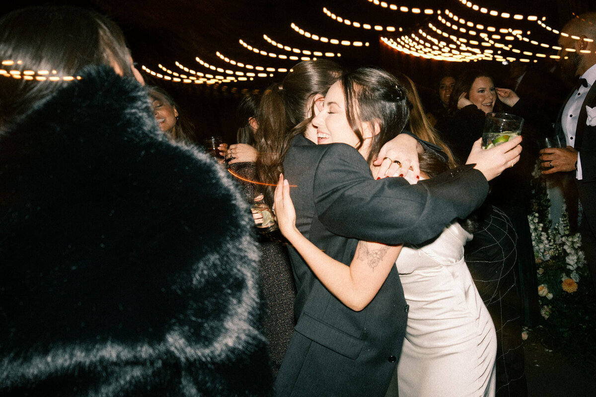 Best man jumps over six people laying down on dancefloor at Glen Foerd Estate in Philadelphia, PA