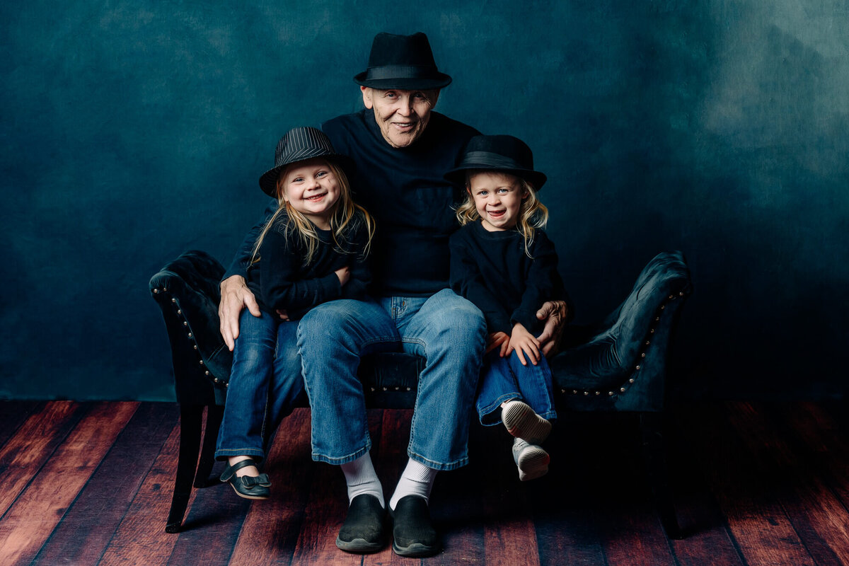 Grandfather hugs granddaughters in Prescott family photos