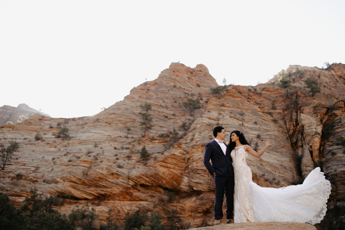 Bride and Groom Portrait in front of Boulder in Zion National Park