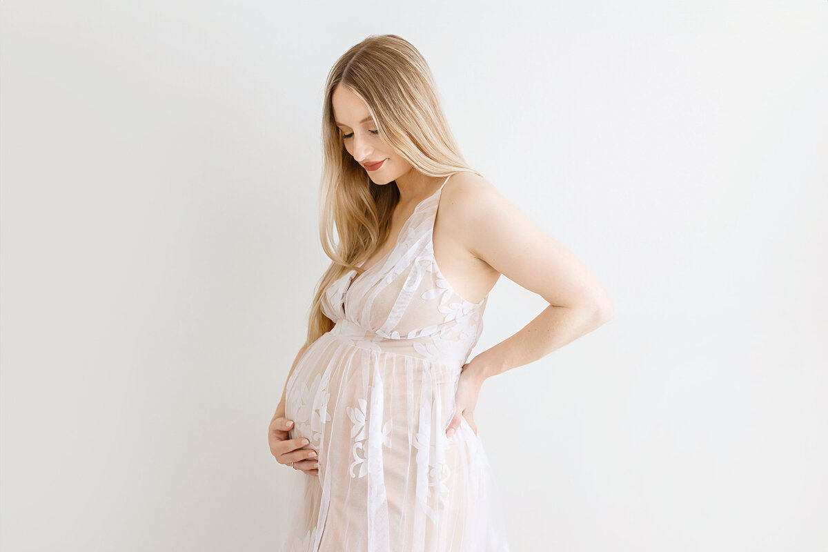 woman holding belly and back