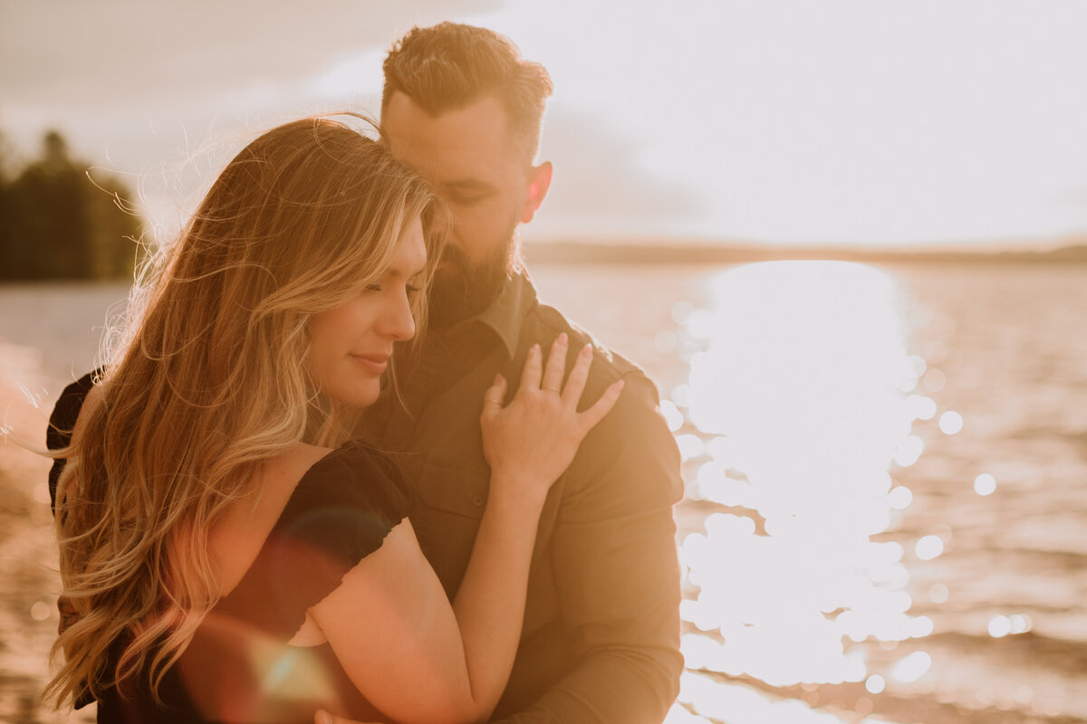alana-andrew-engagement-cottage-beach-lake-sunset-dock-algonquin-12