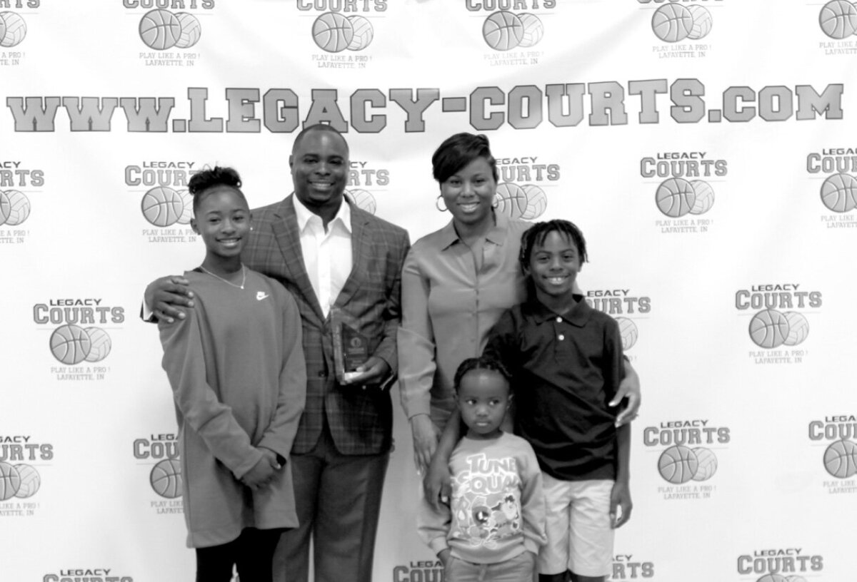 Donte Wilburn and family smiling for photo together