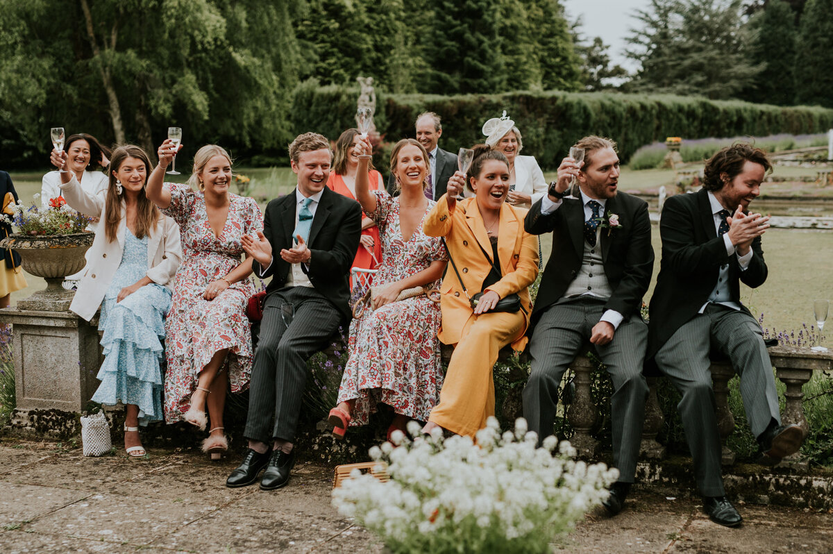 wedding guests toasting to a speech