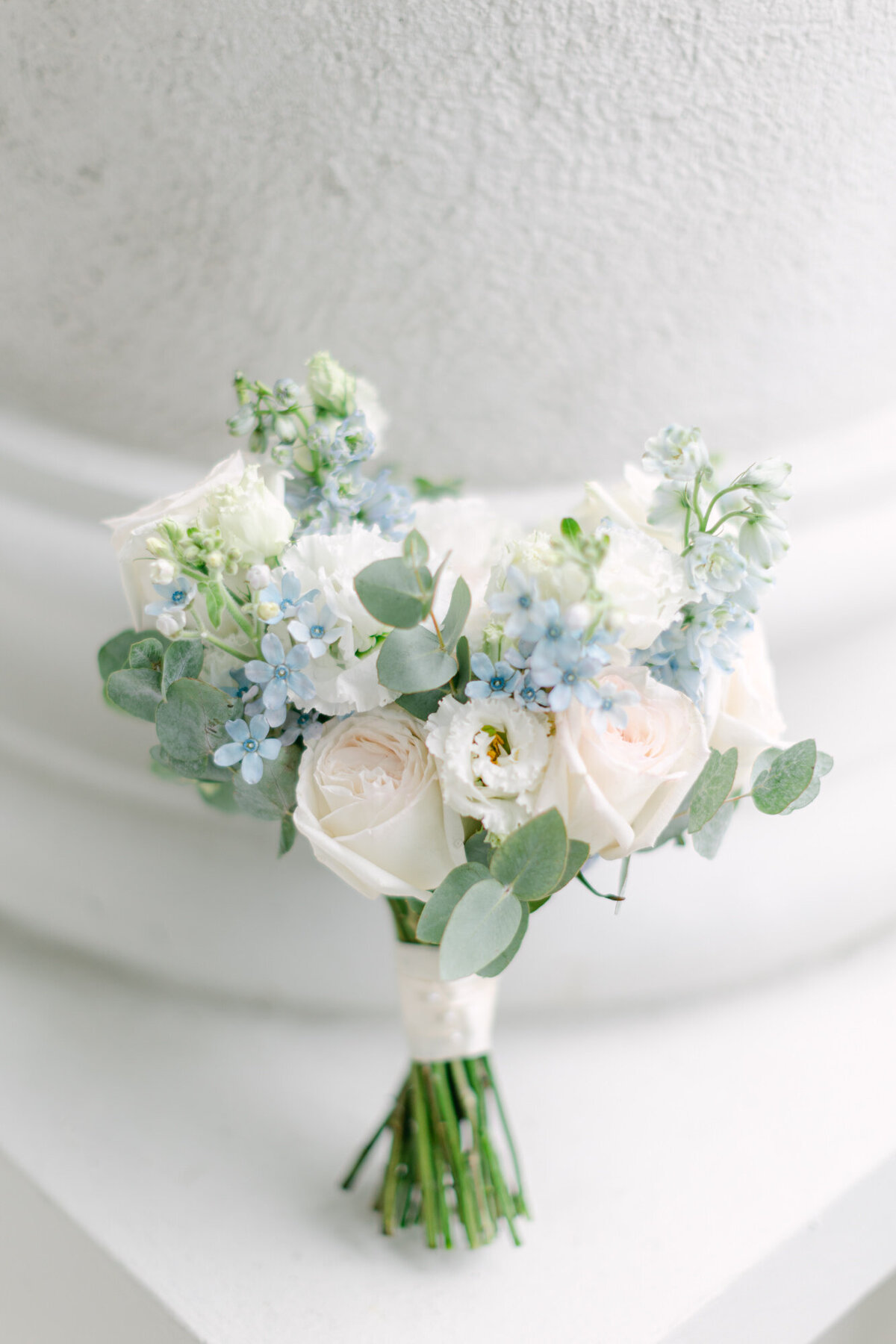 Elegant blush and blue wedding bouquet by destination wedding planner ECLAT