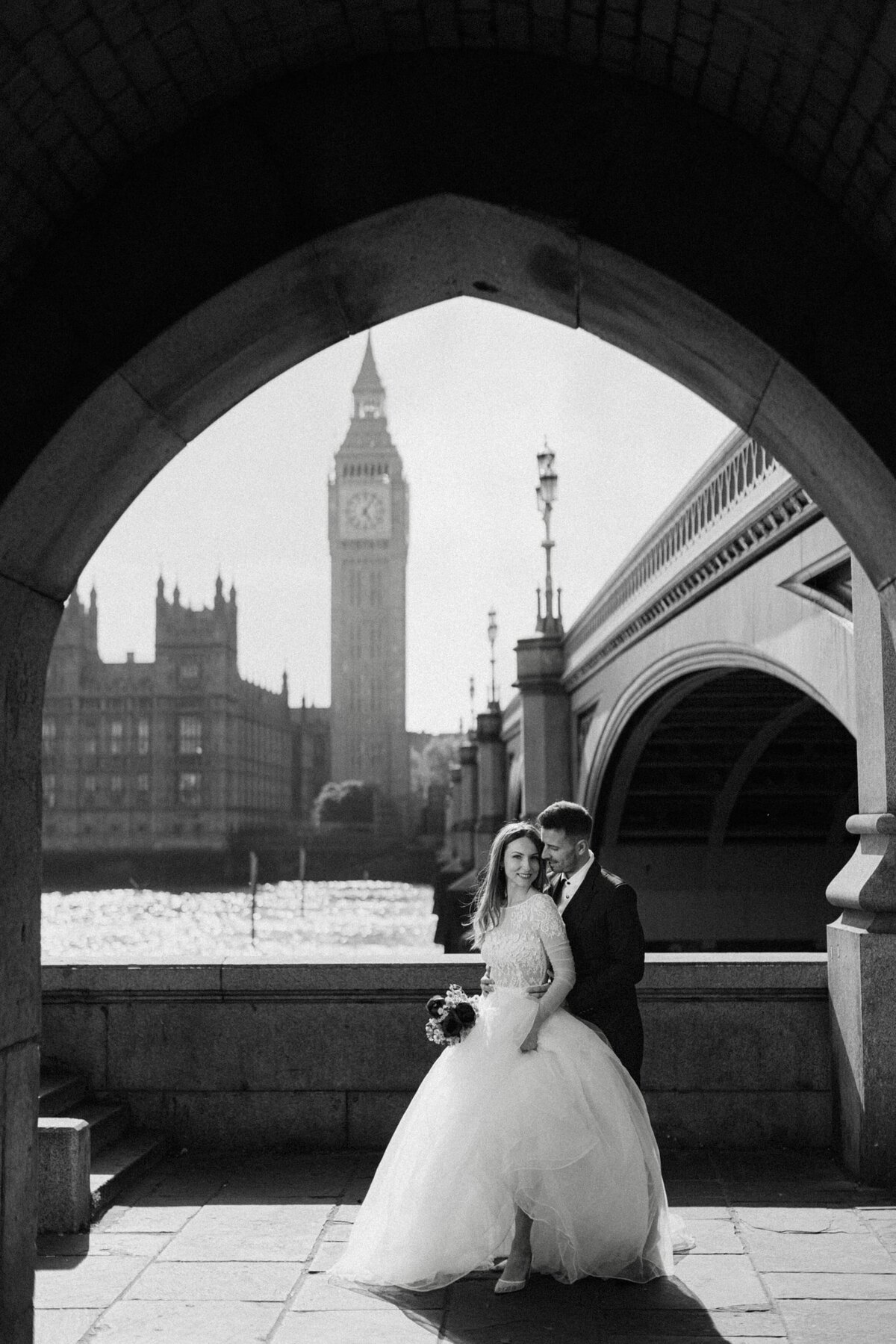 Couple posing for London elopement photographer during their wedding photography in front of BigBen  Westminster