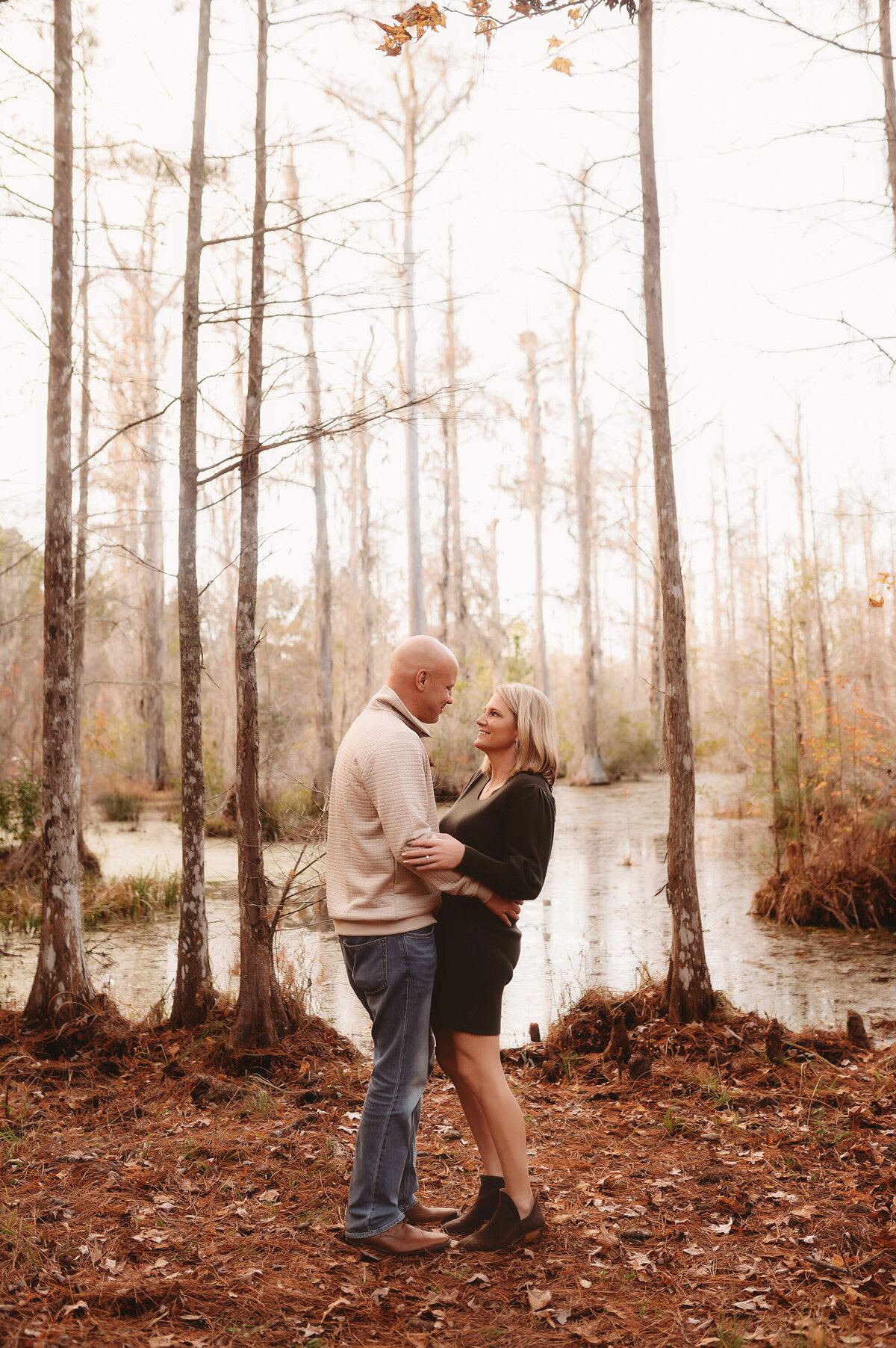 Couple laughs together during  Family Portraits at Cypress Gardens near Charleston, South Carolina.