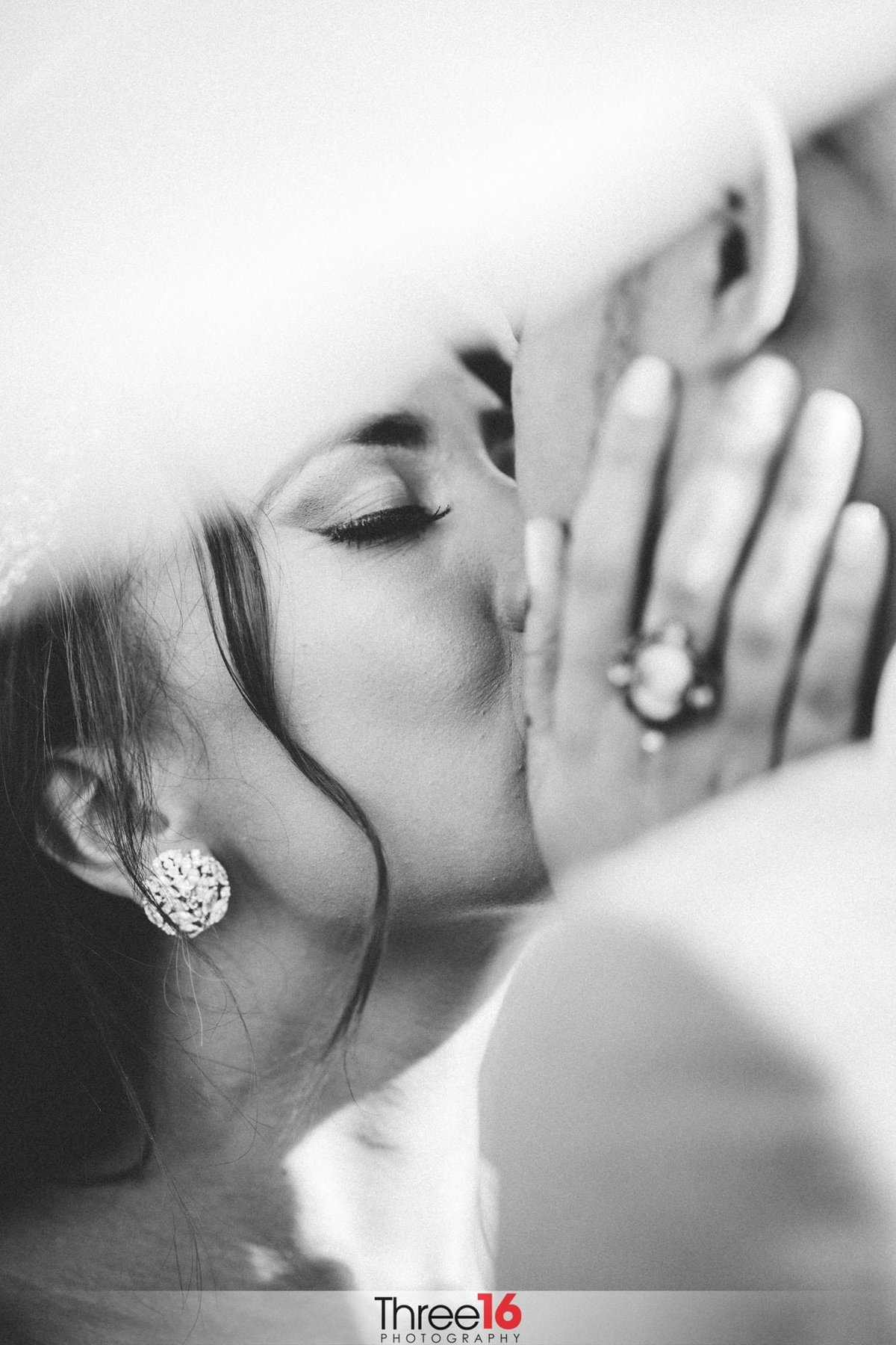 Bride shares intimate kiss with her Groom
