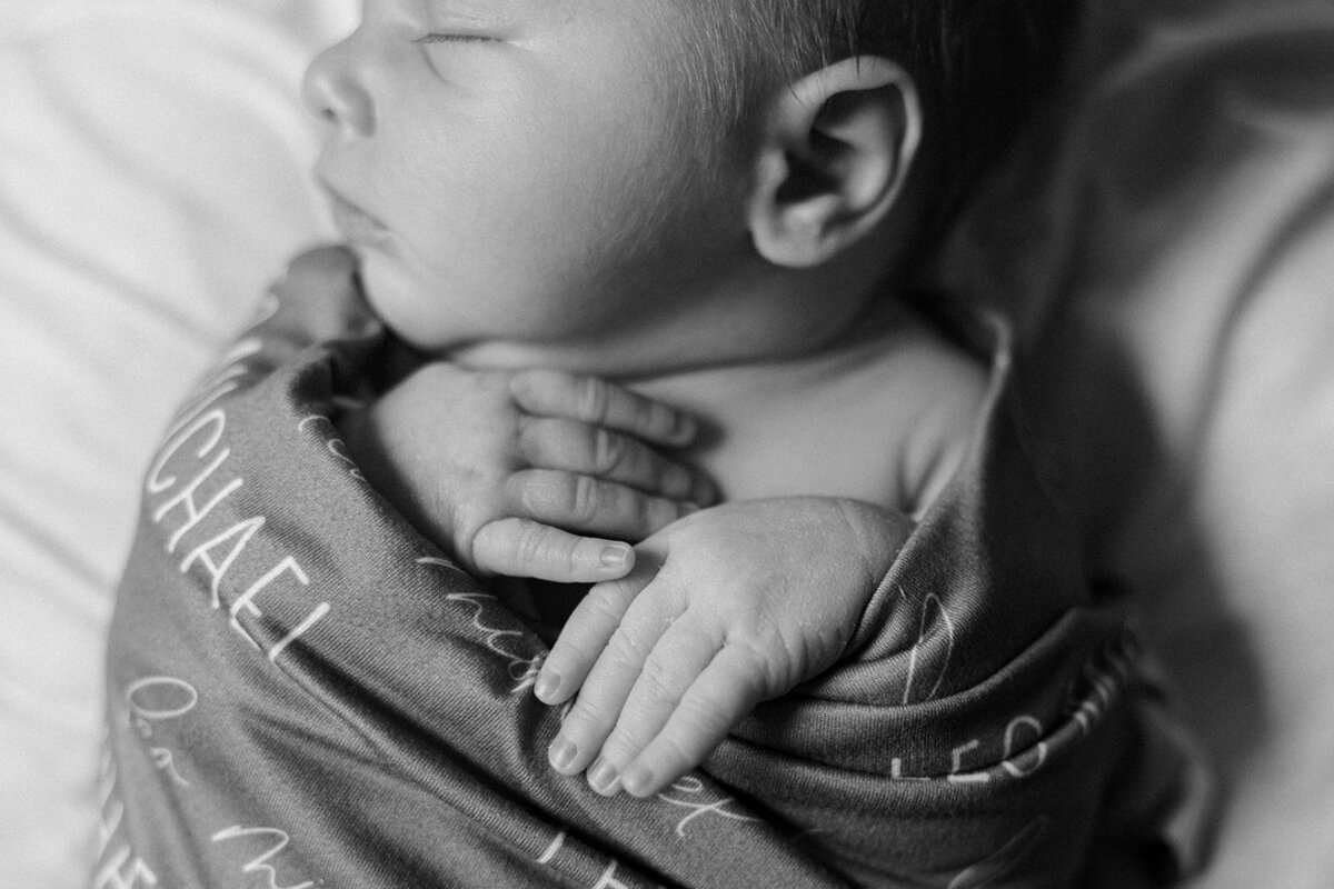 Closeup of a newborn swaddled