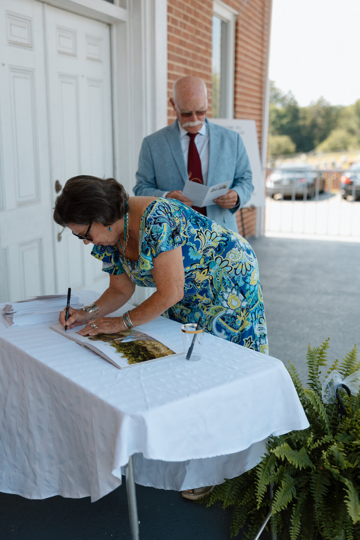 Guests sign guestbook prior to ceremony
