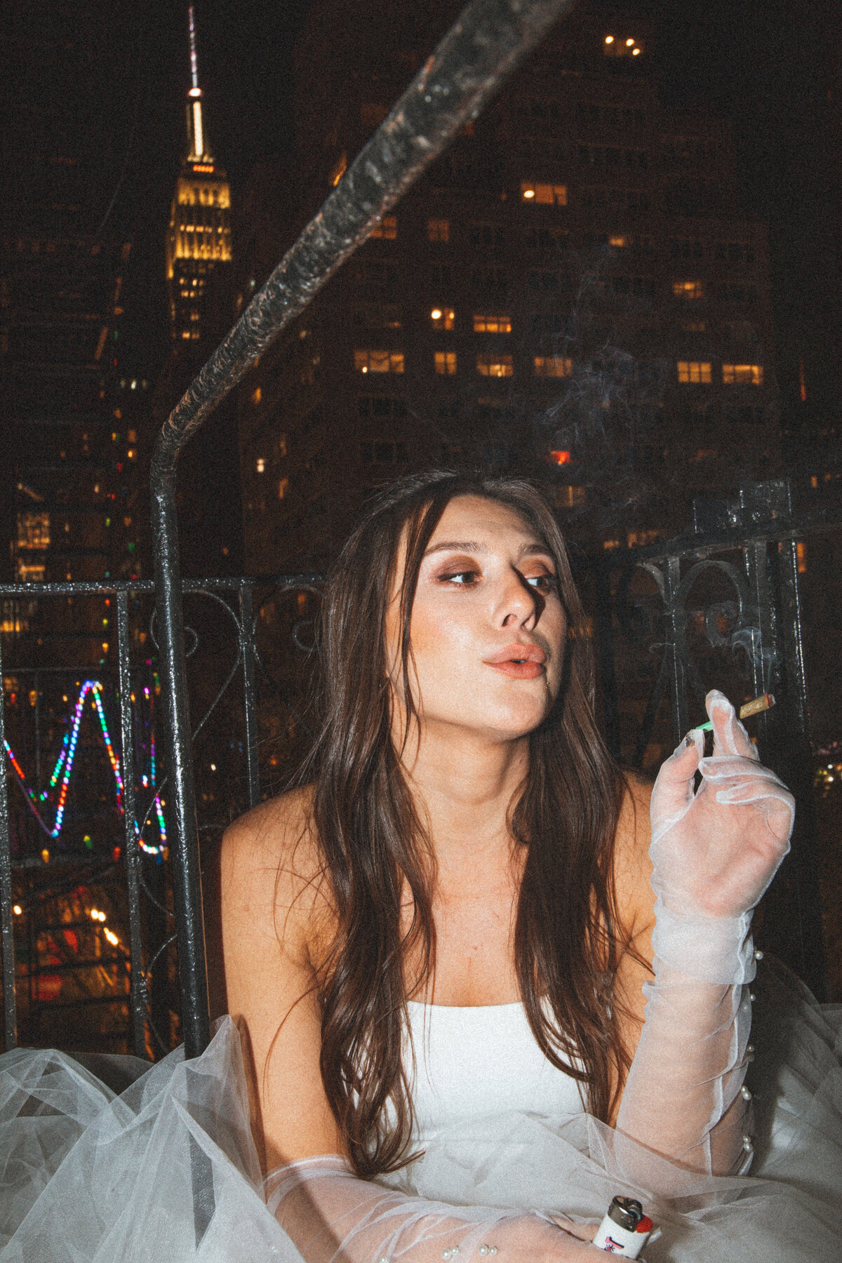 bride smoking on fire escape